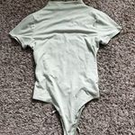 Love j  mock neck open back bodysuit size medium Photo 0