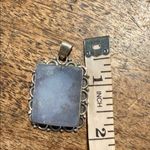None sterling silver pendant with a rectangular moonstone ornate bezel setting. Photo 4
