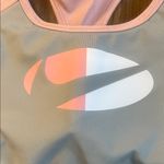 Nike Women’s Racerback Athletic Padded Sports Bra Pink and Gray Size Medium Photo 1