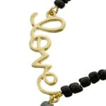 Black Bead GOLD TONE LOVE TASSEL CHARM NECKLACE Photo 1