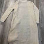 Boho Style Cream knit duster with fringe detailing, long sleeve, and open fron Size undefined Photo 1
