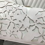 Bebe  Blush on Shiny Champagne Crossbody Laser Cut Photo 1