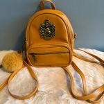 Universal Studios Harry Potter Hufflepuff Crest Mini Backpack Yellow Photo 0