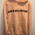 Talentless  Peach Sweater with Black Text Photo 0