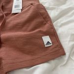 Adidas shorts Size XS Condition: NWT Color: pink Details : - Logo tab on side Photo 4