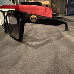 Gucci GG1714S cat-eye sunglasses with a black frame and solid grey lenses Photo 13