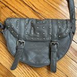 Gray studded faux leather cross body bag. Magnetic snaps on the front. Photo 0