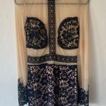 A'Gaci tan and black sheer long sleeve mini dress with embroidered detail Photo 1