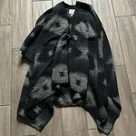 Others Follow  black and gray poncho Photo 0