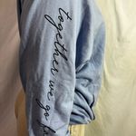 Peloton  hoodie (t-shirt like material) blue with hood and front zip size Medium Photo 3