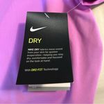 Nike  Women's Size M Dri-Fit UPF 40+ Pink Swoosh Swim Short Sleeve Shirt Gorpcore Photo 3
