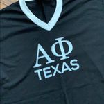 Alpha phi T Photo 1