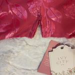  . Velvet Vibrant Pink Dress Size 6. Chic Ivy City Co. dress in vibrant pink. Features elegant floral accents. Ideal for stylish events.. NWT Photo 3