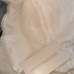 Design History 
SS Mixed Media Split‎ Neck Knit Top Photo 5