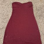 Elliatt Elevate your style with this chic strapless burgundy midi dress. Perfect for any occasion, it offers a blend of elegance and sophistication. Photo 1