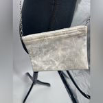 Silver crossbody purse with‎ silver chain and stud design Photo 4