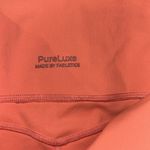 Fabletics Oasis PureLuxe High-Waisted Twist 7/8 Legging- Coral Haze Photo 5