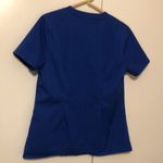 Jaanuu  Women’s Blue Nurse Hospital Scrub Top Size Medium Photo 4