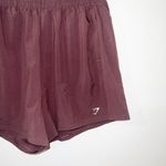 Gymshark women’s brown purplish pull on active running shorts Photo 1