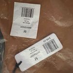 We Wore What ‎ Nylon Biker Short in Gold Photo 14