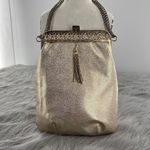 Vintage gold shimmering faux leather glam handbag with tassel. Gold Photo 4