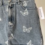 PacSun  new with tags butterfly denim jean skirt in a size 26 Photo 11