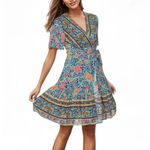 Zesica Dress Sz L Blue Floral Wrap Sundress Boho VNeck Flutter Sleeves Feminine Size L Photo 1