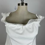 About Us  White Ruffle Crop Blouse Photo 2