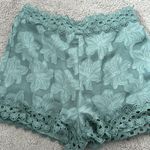 Sage green dressy shorts with lace trim Photo 0