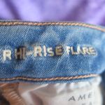 American Eagle Outfitters next level stretch super hi-rise flare jeans in medium wash blue size 4. Photo 13