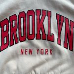 Brooklyn New York Long Sleeve Cropped Hoodie in Beige/Red Size Medium Red Photo 2