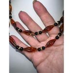 Monet Vintage  Faux Amber and Black Plastic Bead Barrel Closure Necklace 36” Photo 4