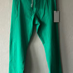 Social Tourist Green Crossover Leggings with Pockets Size Medium NWT Photo 0