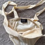 Cider  bandeau.  Size Small. Zip closure on side. Straps tie into bows. Photo 4