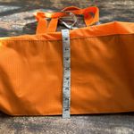 Baggallini  orange carry all nylon tote large with pink lining Photo 12