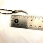 Silver tone horn pendant necklace on brown cord Photo 5