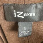 Iz Byer Brown animal print faux wrap top dress with pockets size medium Photo 4