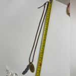 Leather Necklace with feather pendant and oval pendant that says God is Faithful Photo 6