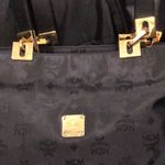 MCM  Black and Gold Monogram Shoulder Bag with Top Zipper Closure Made In Germany Photo 1
