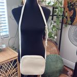 Cuyana Cream Pebbled Leather Tassel Zip Crossbody Camera Bag Photo 1