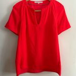 Trina Turk | Hot Coral Split Neck Drop Hem Short Sleeve Top Neon | Size Small Photo 0
