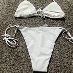 Louryn Koulyn Elegant and stylish white halter bikini set perfect for beach days. Enjoy comfort and style with this must- have swimwear. Photo 4