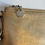 NY&CO GOLD WRISTLET WITH 3 RINGS AS WRISTLET HAS RIBBON DEATTACHABLE ADORNMENT Photo 1