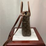 Rosetti purse. Dark taupe with brown leather handles and strap. Super cute Photo 5