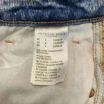 American Eagle ⭐️  light wash distressed mom jeans in size 4 Photo 6