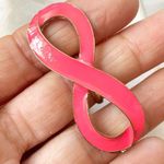 Pink and gold tone infinity ring Photo 2