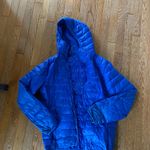 Vibrant Blue Hooded Puffer Jacket Photo 0