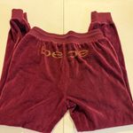 Bebe  Sport Burgundy Velour Jogger Pants Small Gold Logo Bling Bedazzled Cuffed Photo 0