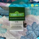 Sesame Street women's L blue and lavender short sleeve cookie monster scrub top Photo 9