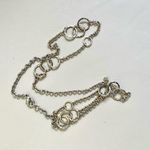 Long silver tone necklace with circles Photo 1
